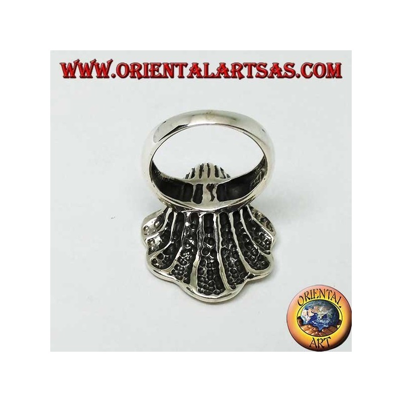 Silver ring with natural pearl in the oyster coat