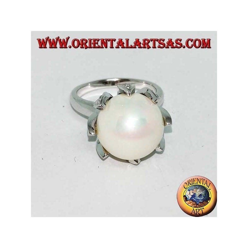Silver ring with giant natural pearl set in the petals of a flower