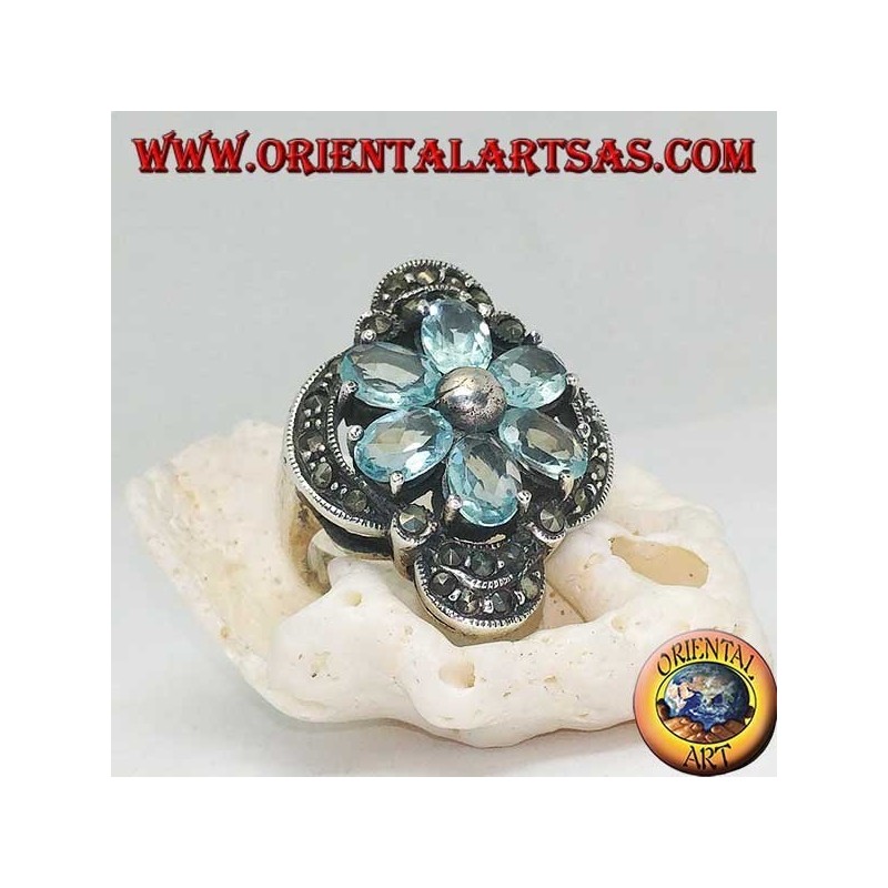 Silver Bethlehem flower ring with blue topaz petals set crowned with silver and marcasite