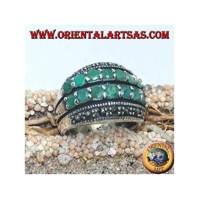 Silver ring with a rounded band with two rows of emeralds set between two rows of marcasites