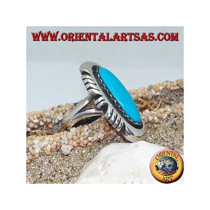 Silver ring with elongated oval turquoise on a smooth frame ruled on the sides