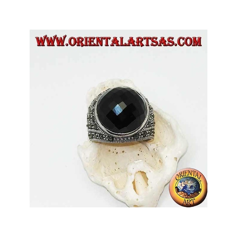 Silver ring with round faceted cabochon onyx surrounded by marcasites on the sides