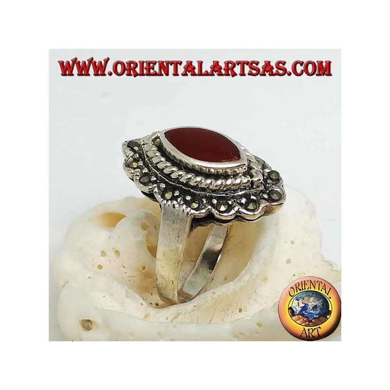 Silver ring with shuttle carnelian surrounded by braid and a row of marcasite