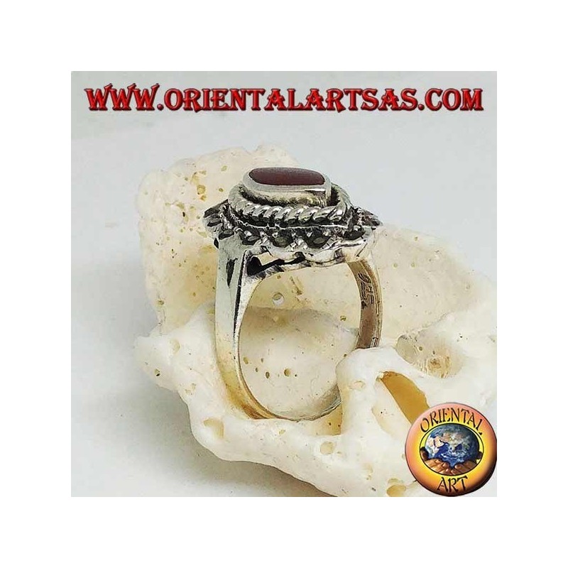 Silver ring with shuttle carnelian surrounded by braid and a row of marcasite
