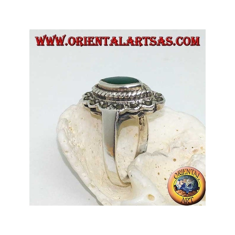 Silver ring with green shuttle agate surrounded by braid and a row of marcasite