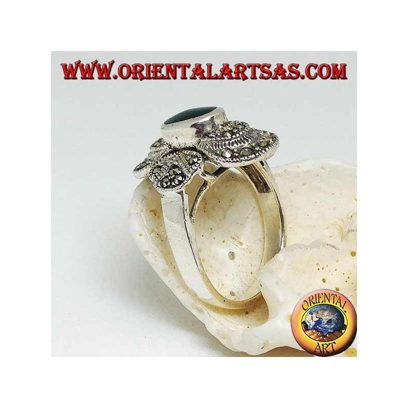 Silver ring with oval green agate on a round frame studded with marcasite
