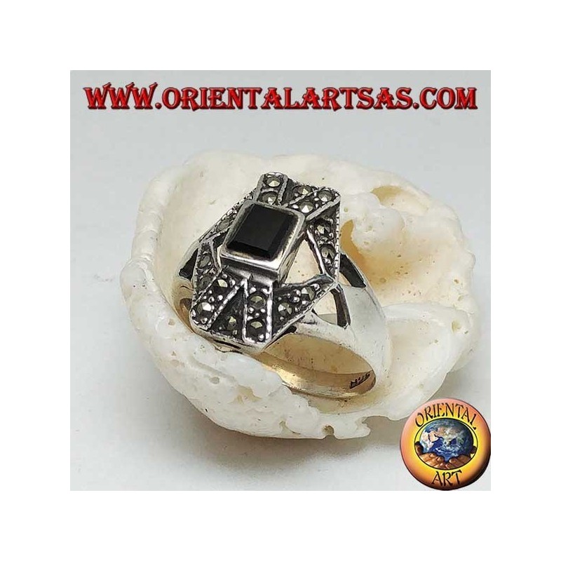 Silver ring with rectangular onyx overlapping X and hexagon with marcasite