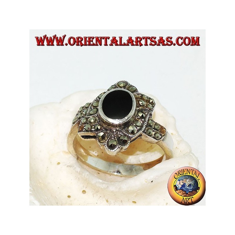 Silver ring with oval onyx surrounded by marcasite with an oblique band