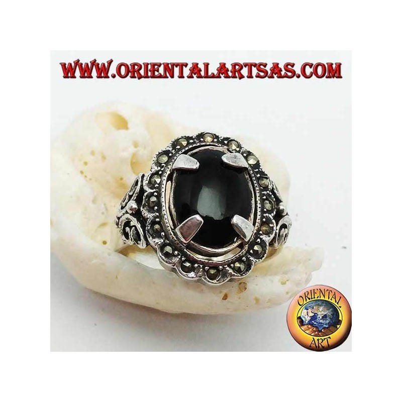 Silver ring with oval cabochon onyx set and surrounded by marcasite balls