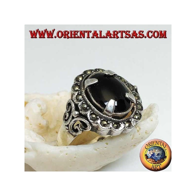 Silver ring with oval cabochon onyx set and surrounded by marcasite balls