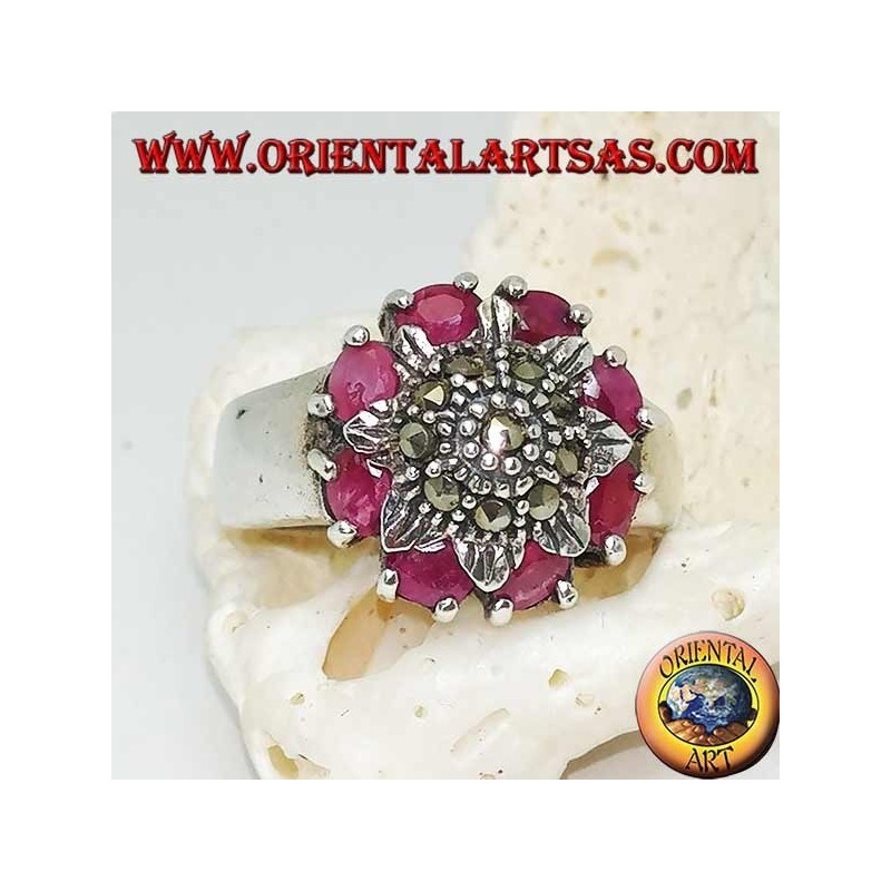 Silver flower ring studded with marcasites surrounded by natural rubies set