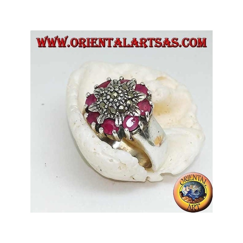Silver flower ring studded with marcasites surrounded by natural rubies set
