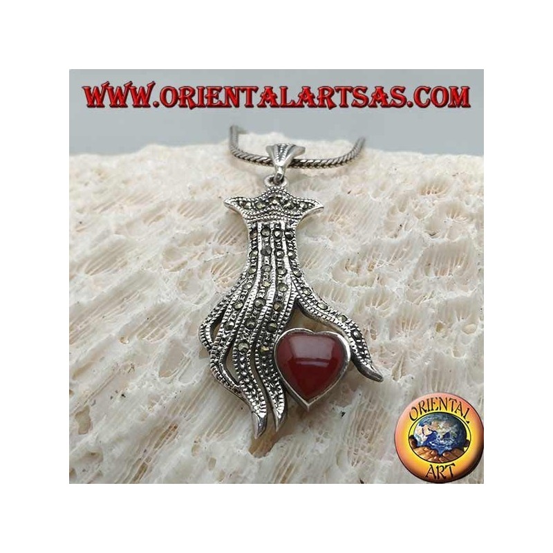 Silver pendant, carnelian heart between the fingers of a hand studded with marcasite