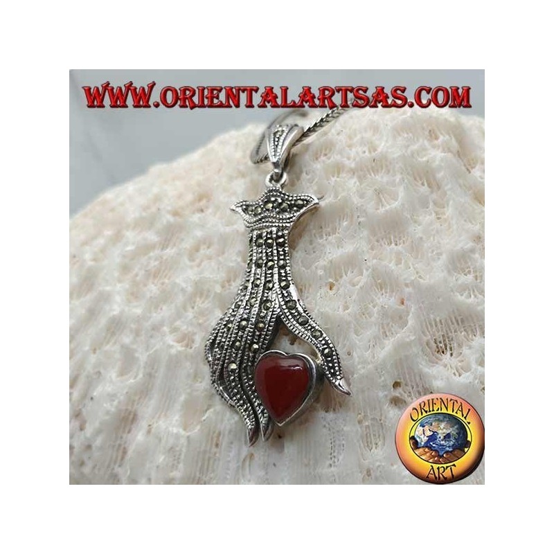 Silver pendant, carnelian heart between the fingers of a hand studded with marcasite