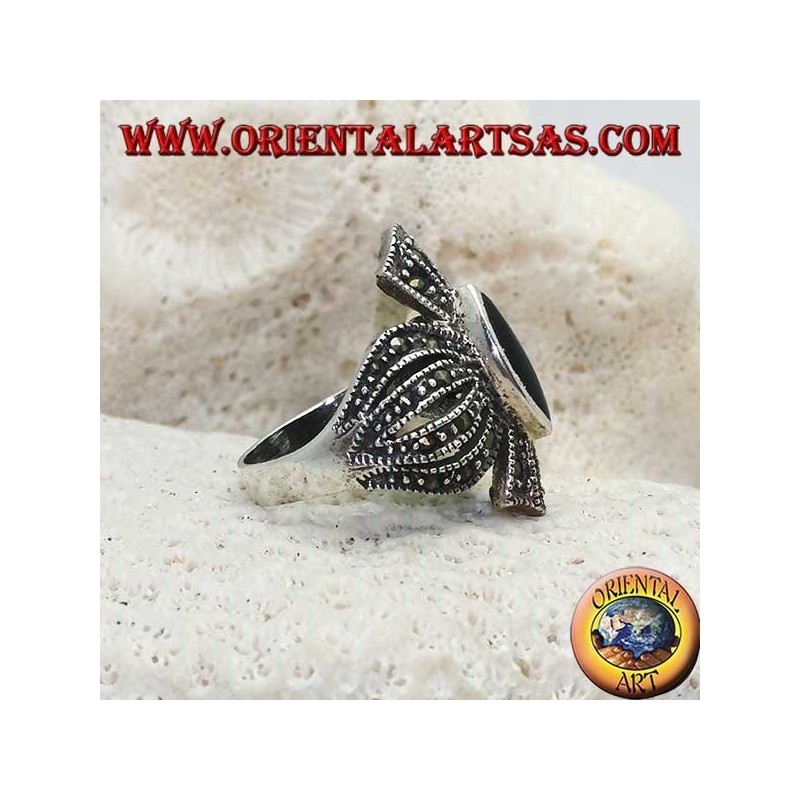 Silver ring with shuttle onyx on a rounded cross frame studded with marcasite