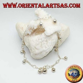 Silver anklet with hanging bells and alternating discs