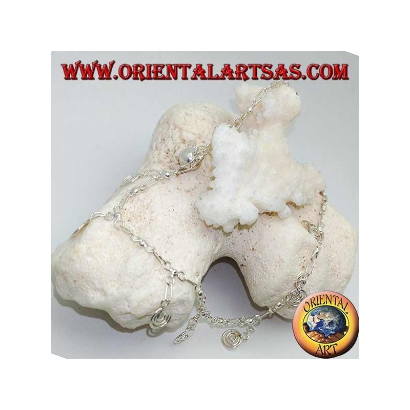 Silver anklet with hanging spirals with a bell