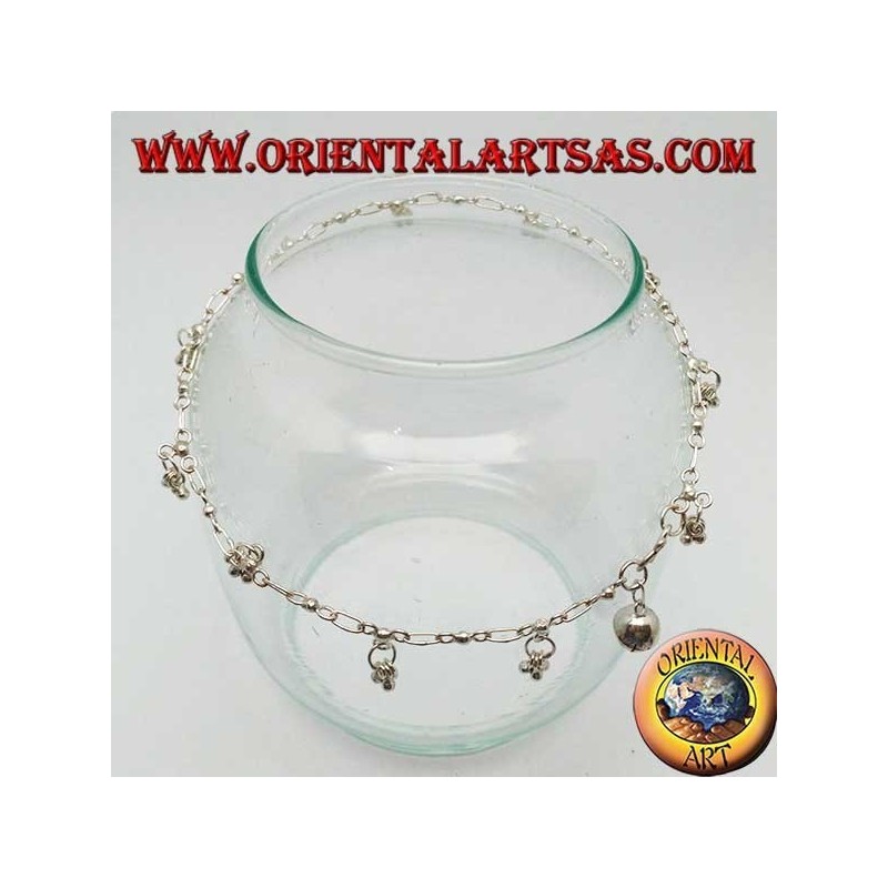 Silver anklet with a series of three hanging balls with a bell