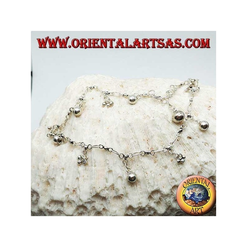 Silver anklet with groups of three balls and alternating hanging bells