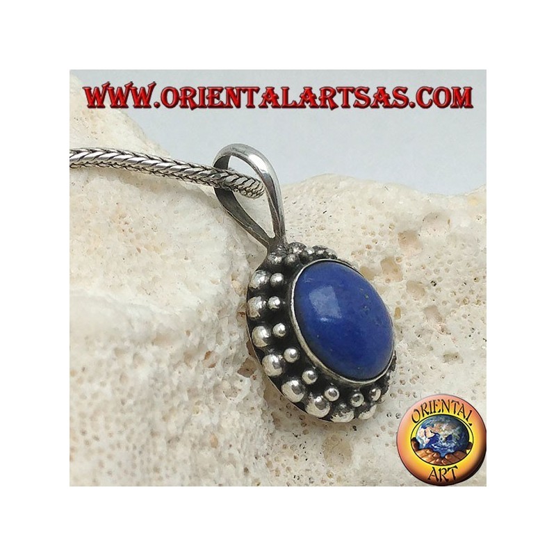 Silver pendant with oval lapis lazuli surrounded by two rounds of spheres...
