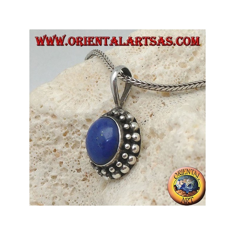 Silver pendant with oval lapis lazuli surrounded by two rounds of spheres...