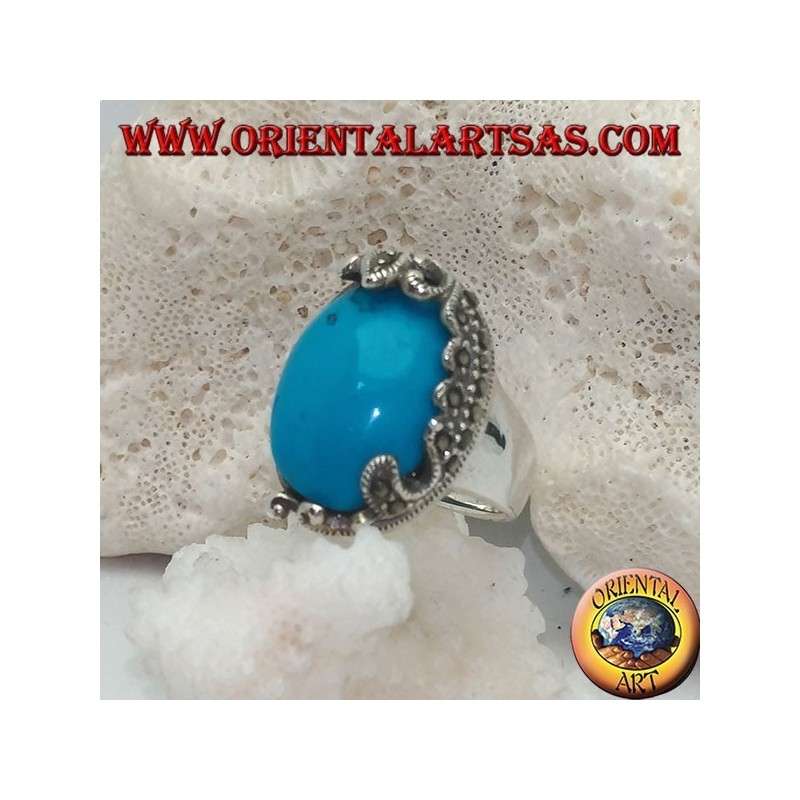 Anello in argento con turchese ovale a cabochon e decorazioni con marcassiti floreali su un solo lato