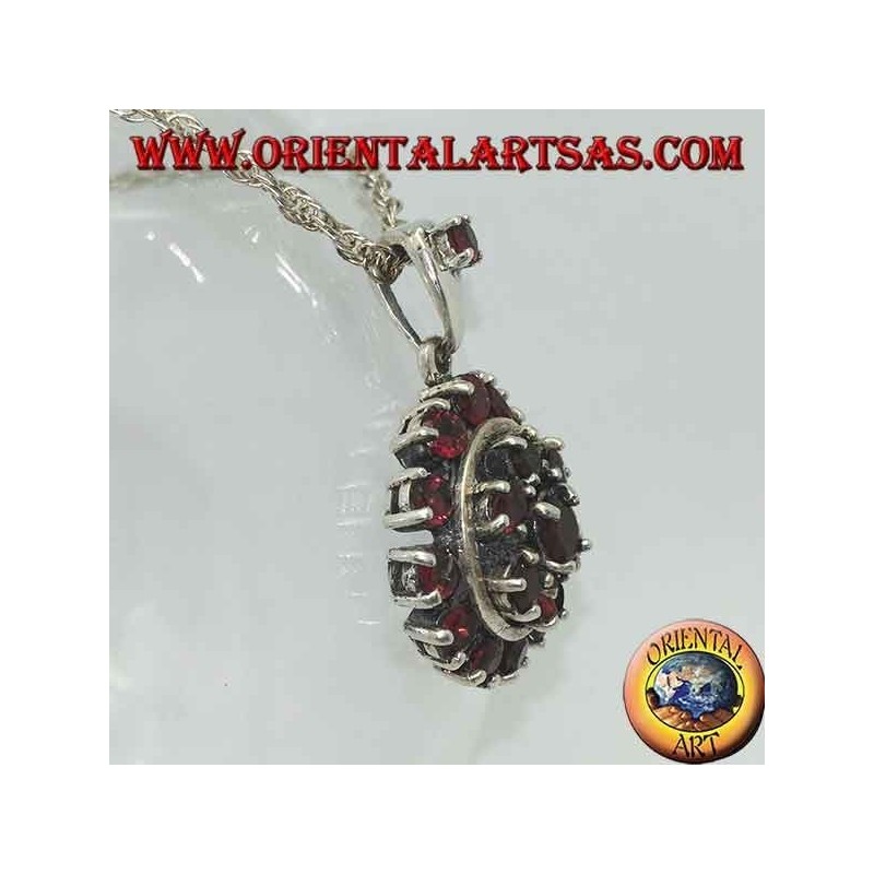 Round garnet silver pendant surrounded by a six-pointed star and a circle of garnets