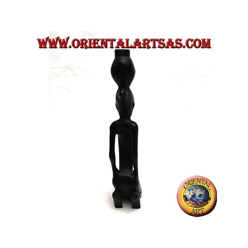 Sculpture of a water pumping woman (water carrier) kneeling in ebony wood