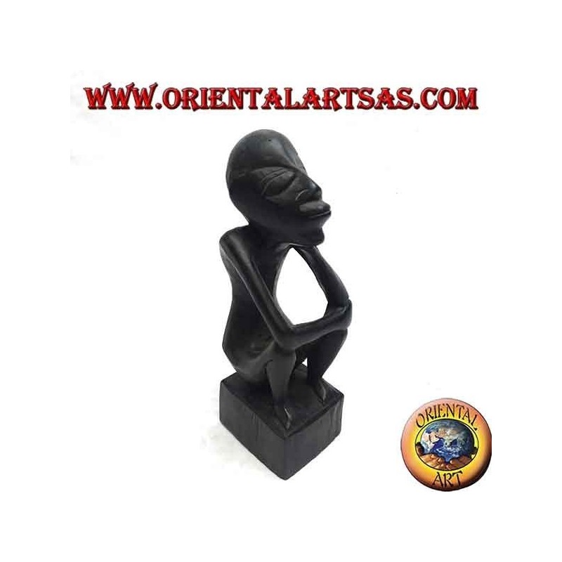 Sculpture of a seated thinker with bent legs in ebony wood