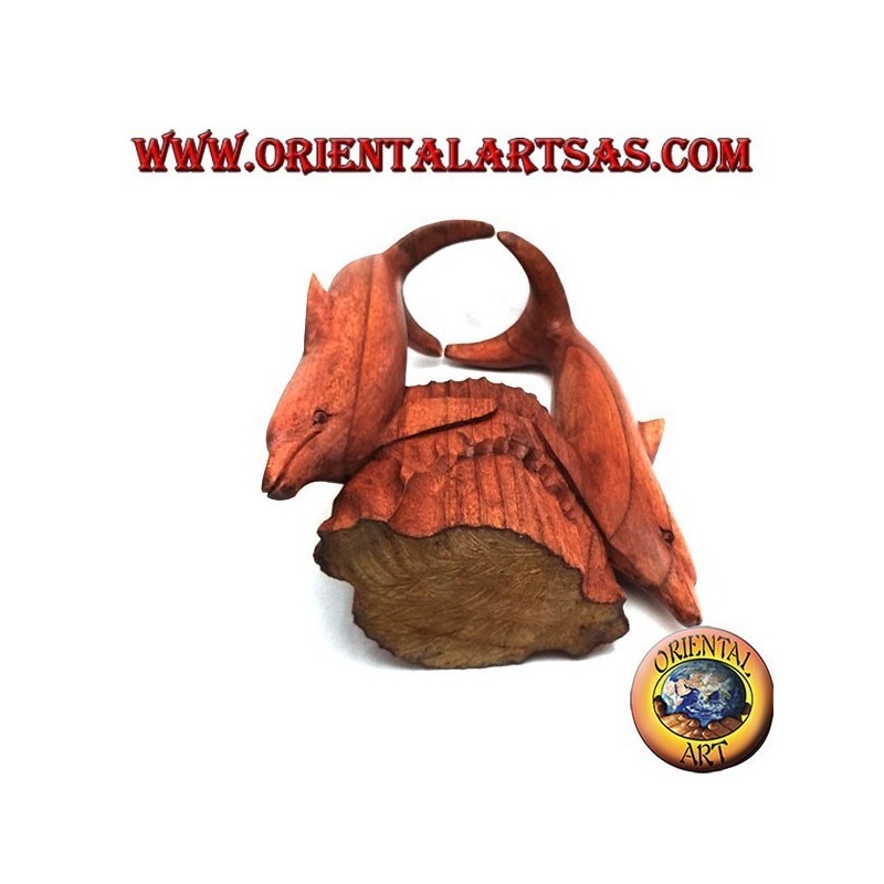 Bottle holder with sculpture of two dolphins in Suar wood acrobatics