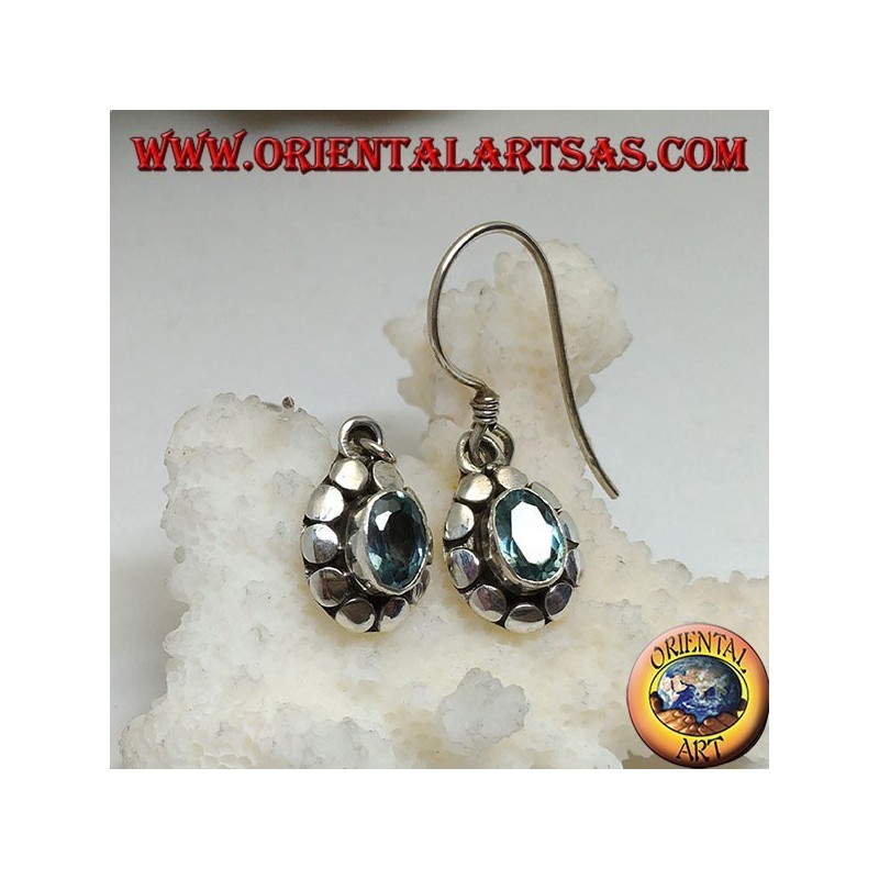 Silver earrings with natural oval blue topaz surrounded by discs