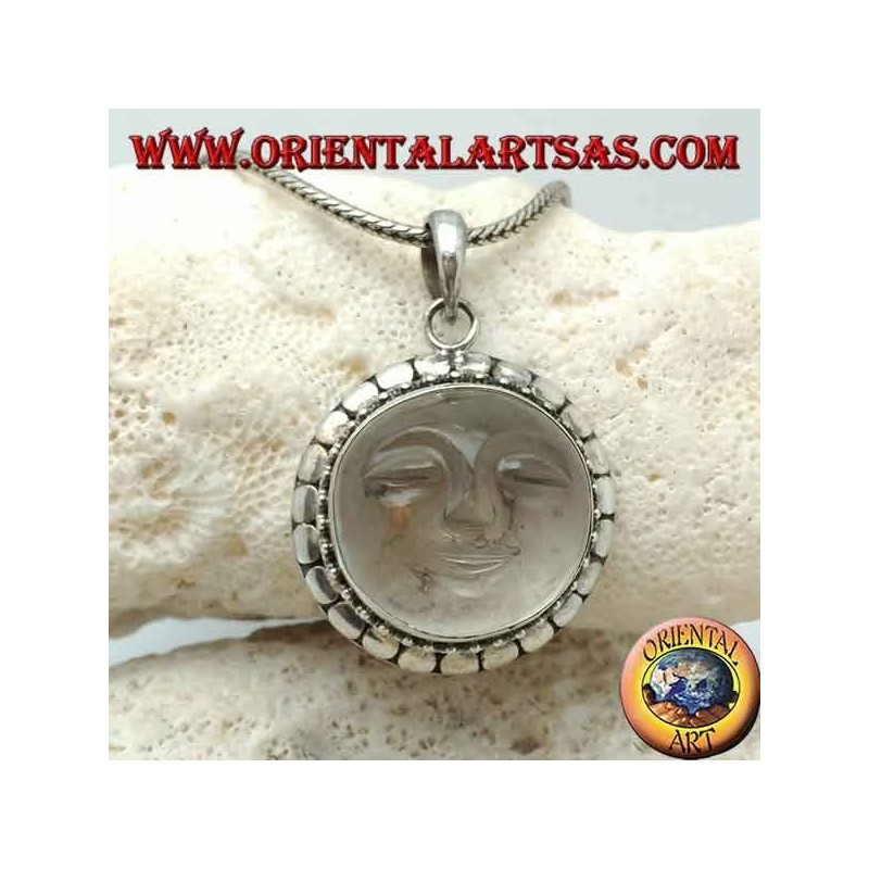 Silver pendant with sun hollowed out on a round rock crystal and diskette contour