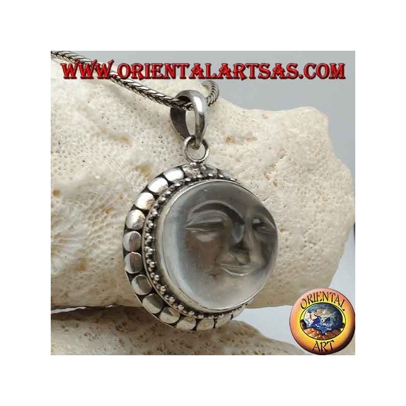 Silver pendant with sun hollowed out on a round rock crystal and diskette contour