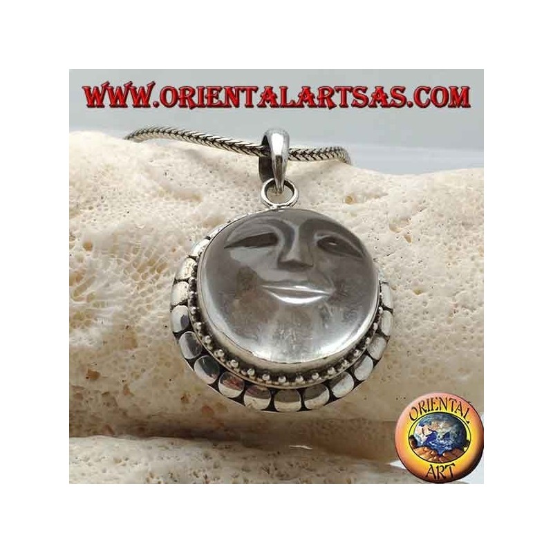 Silver pendant with sun hollowed out on a round rock crystal and diskette contour