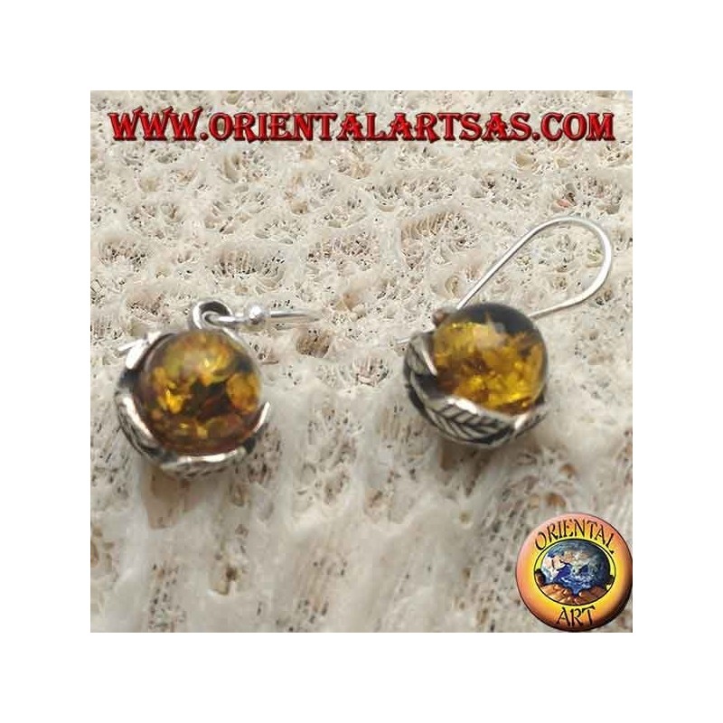 Silver earrings with natural amber sphere between the leaves