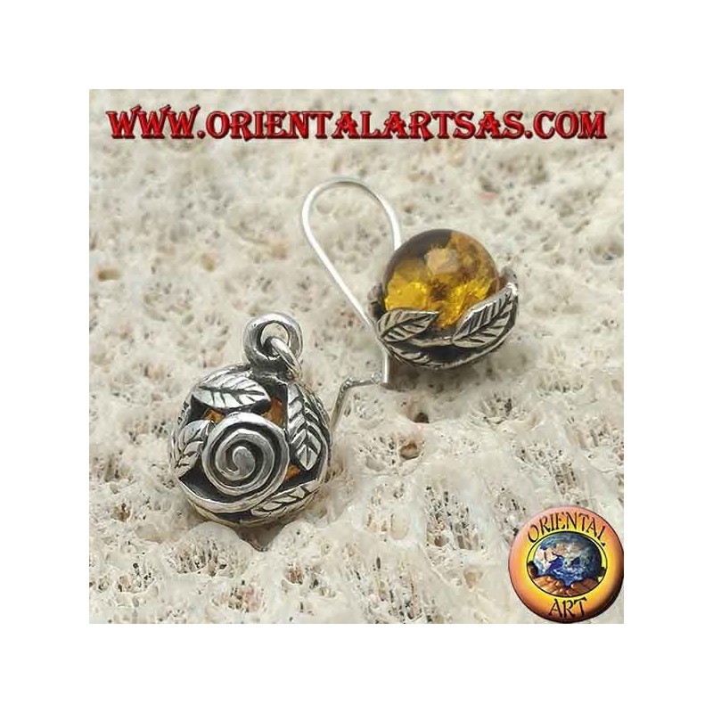 Silver earrings with natural amber sphere between the leaves