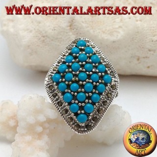 Rhomboid silver ring studded with turquoise balls set surrounded by a row of marcasite stones
