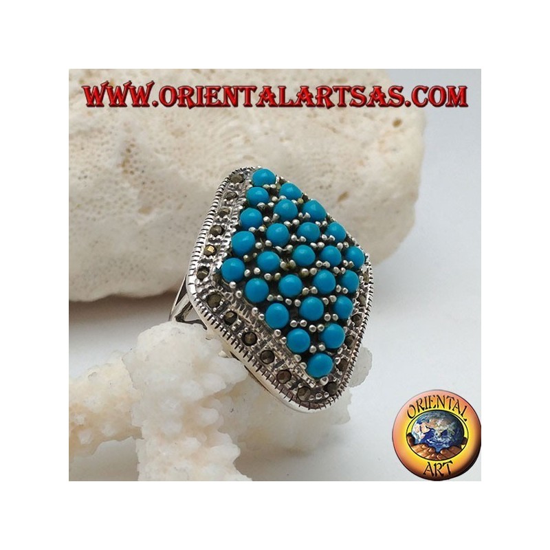 Rhomboid silver ring studded with turquoise balls set surrounded by a row of marcasite stones