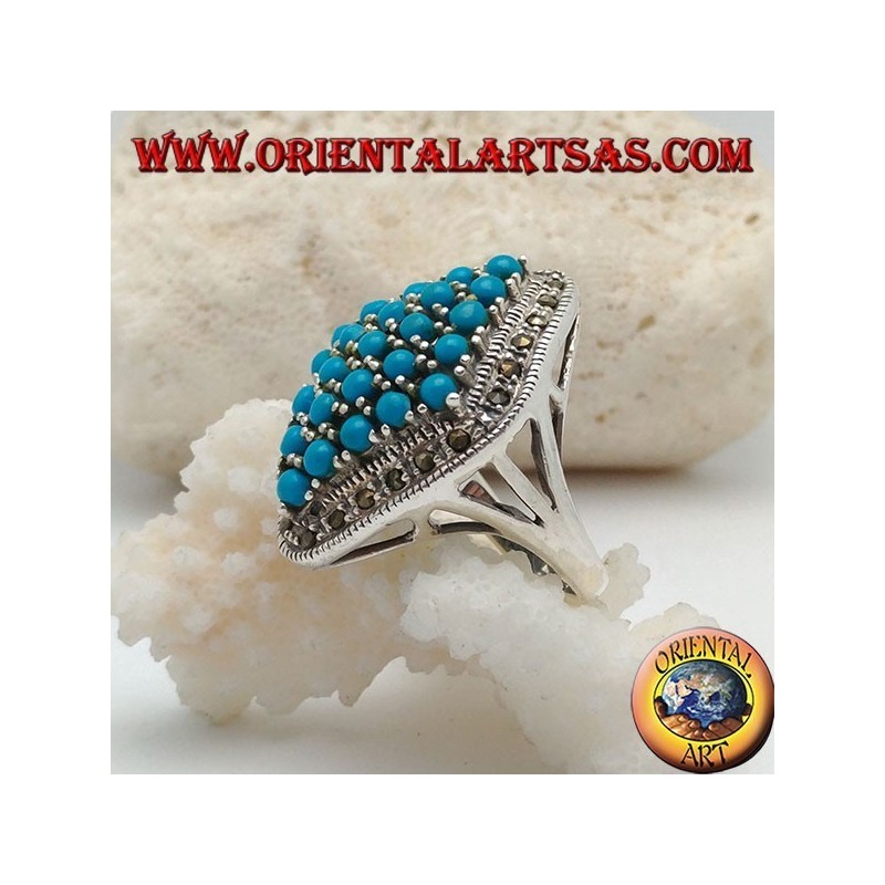 Rhomboid silver ring studded with turquoise balls set surrounded by a row of marcasite stones