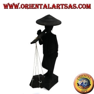 Skulptur eines alten Kuriers mit Strohhut und Stick mit Ebenholzwaren auf der Schulter