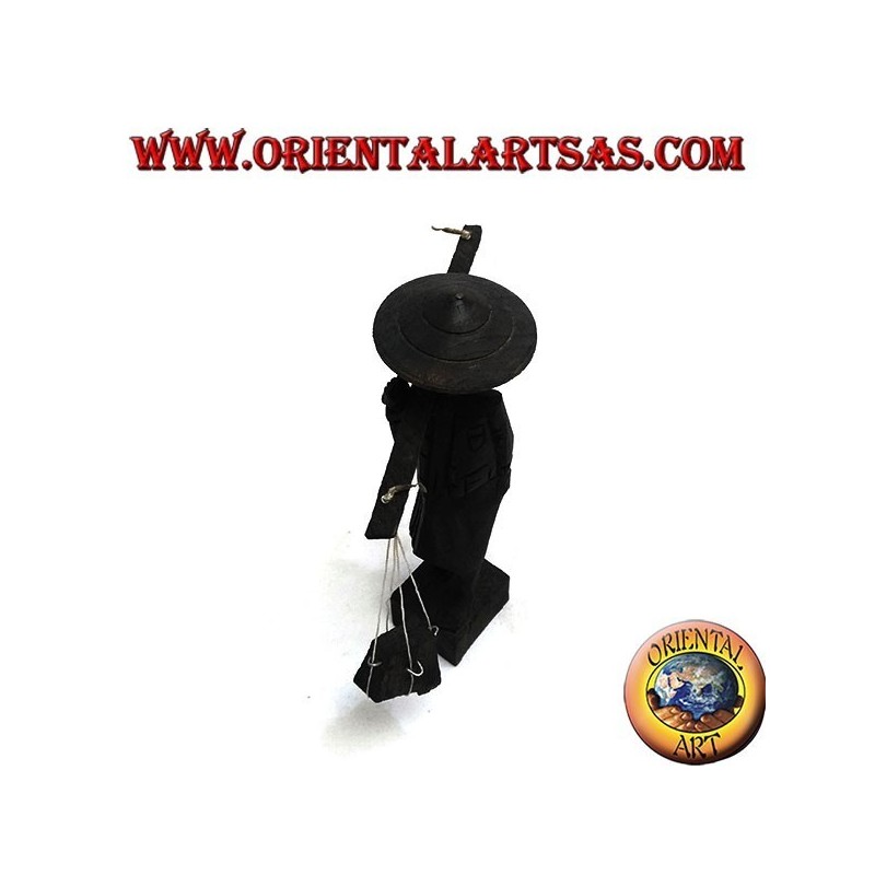 Sculpture of an ancient courier with straw hat and stick with ebony wood goods on the shoulder
