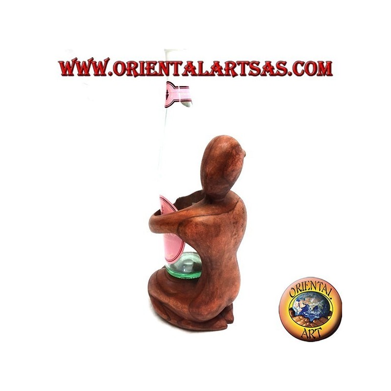 Bottle holder sculpture of a kneeling woman embracing in Suar wood