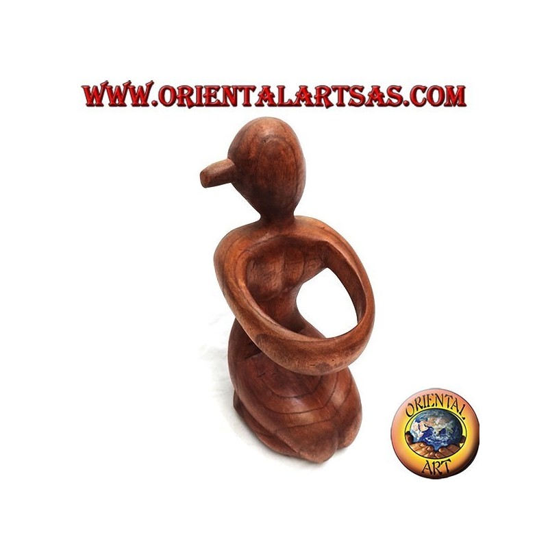 Porte-bouteille sculpture d'une femme agenouillée embrassant en bois de Suar