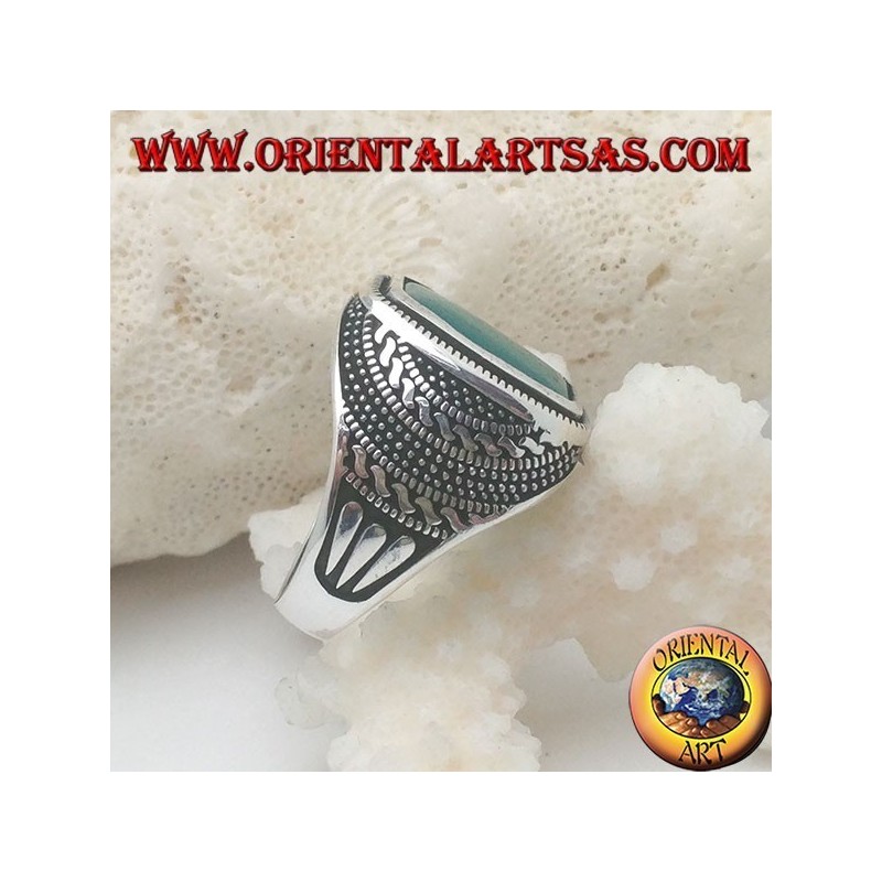 Silver ring with a rectangular green agate rounded in a rosette of balls and weaves