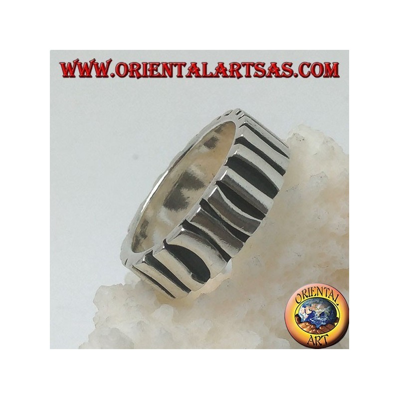 Silver band ring with a row of sticks placed parallel