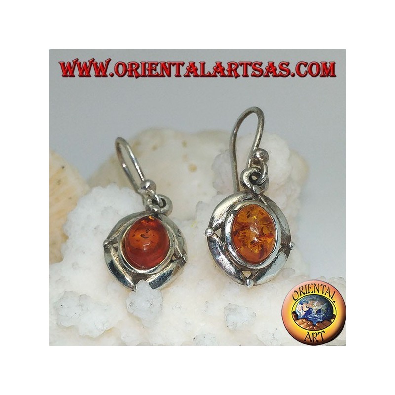 Silver earrings with oval natural amber surrounded by a disc with a ball on the cardinal points