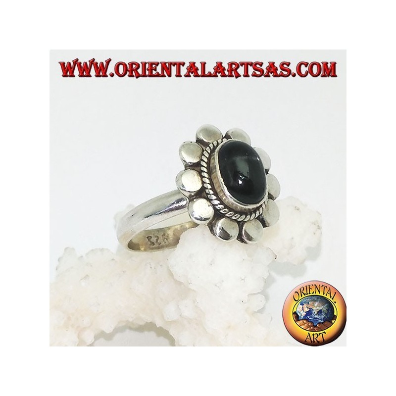 Silver flower ring with oval cabochon black star surrounded by plaiting and diskettes