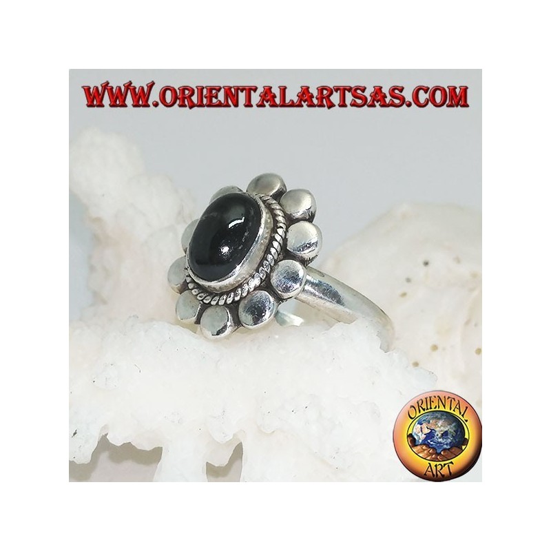 Anillo de flores de plata con cabujón oval estrella negra rodeada de trenzas y disquetes