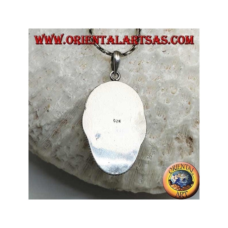 Silver pendant with a face cameo on a fang