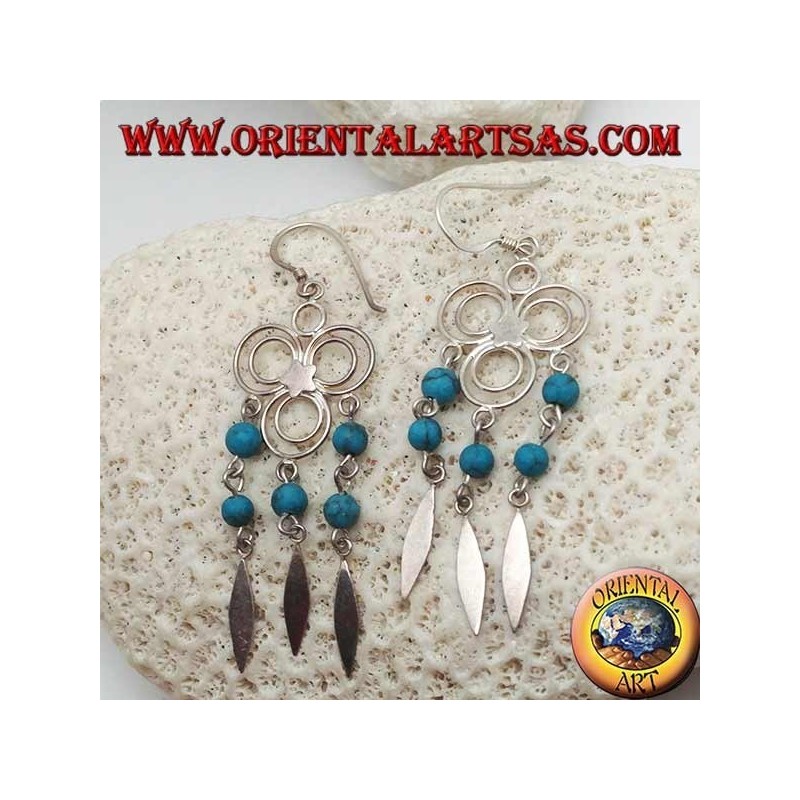 Pendientes de plata de tres círculos con estrella central y hileras colgantes de bolas de turquesa y plata.